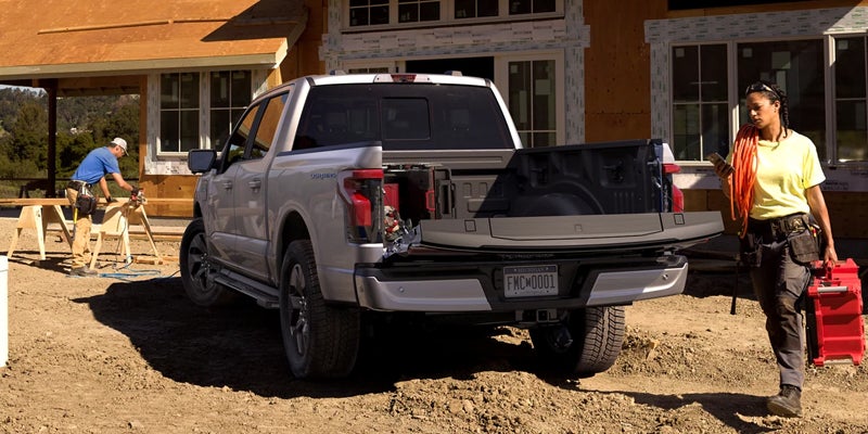 2022 Ford Lightning in red with an open truck bed