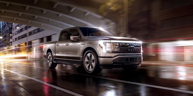 Silver F-150 Lightning in motion