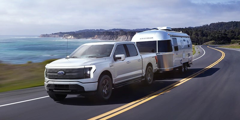 Ford F-150 Lightning towing on highway