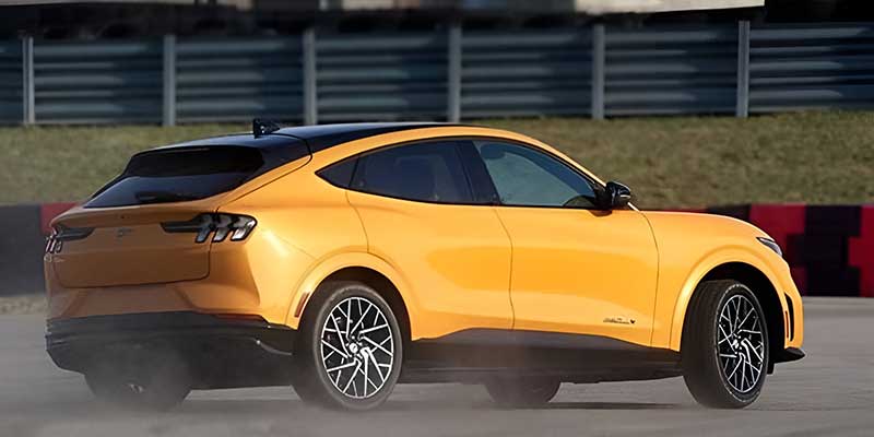 Yellow Ford Mustang Mach-E driving