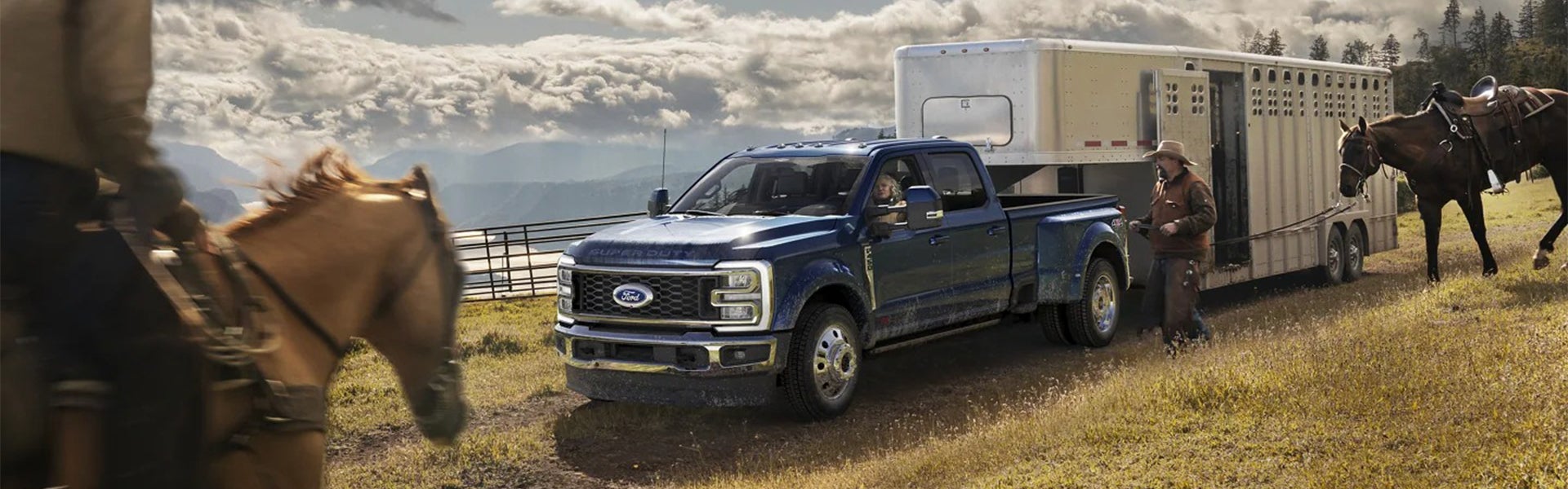 2023 Ford Super Duty pulling a horse trailer on a ranch