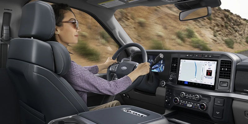 2023 Ford Super Duty close up interior with a woman driving