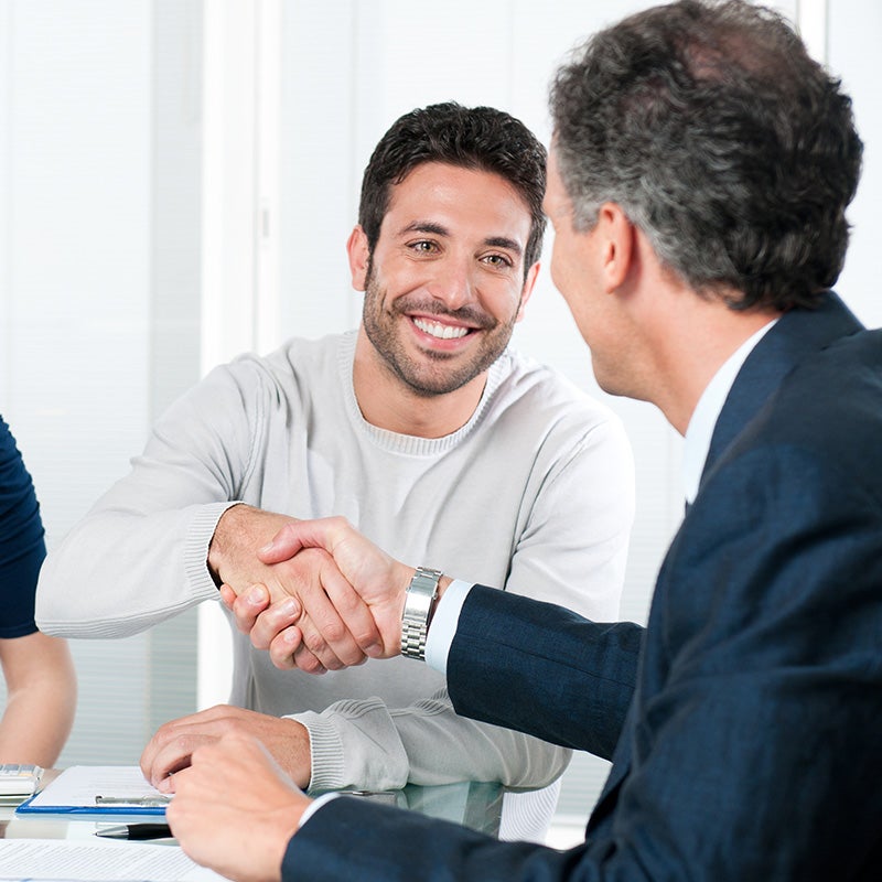 guy shaking hands with sales person
