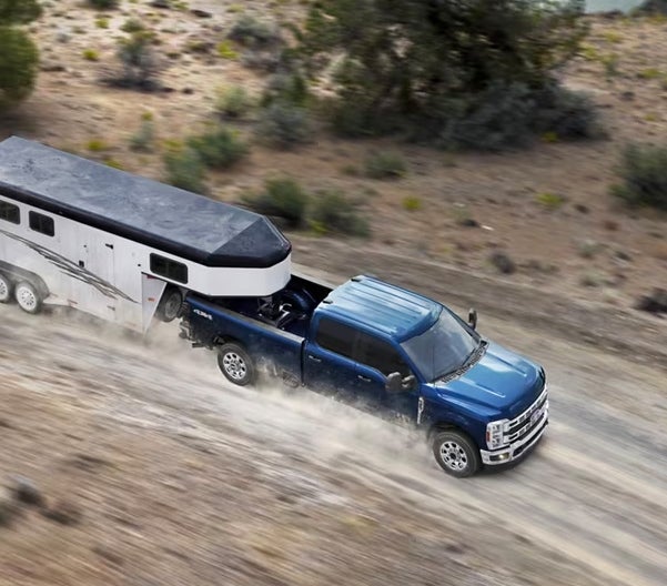 Four Stars Ford in Jacksboro TX SuperDuty birds eye view pulling a horse trailer off road